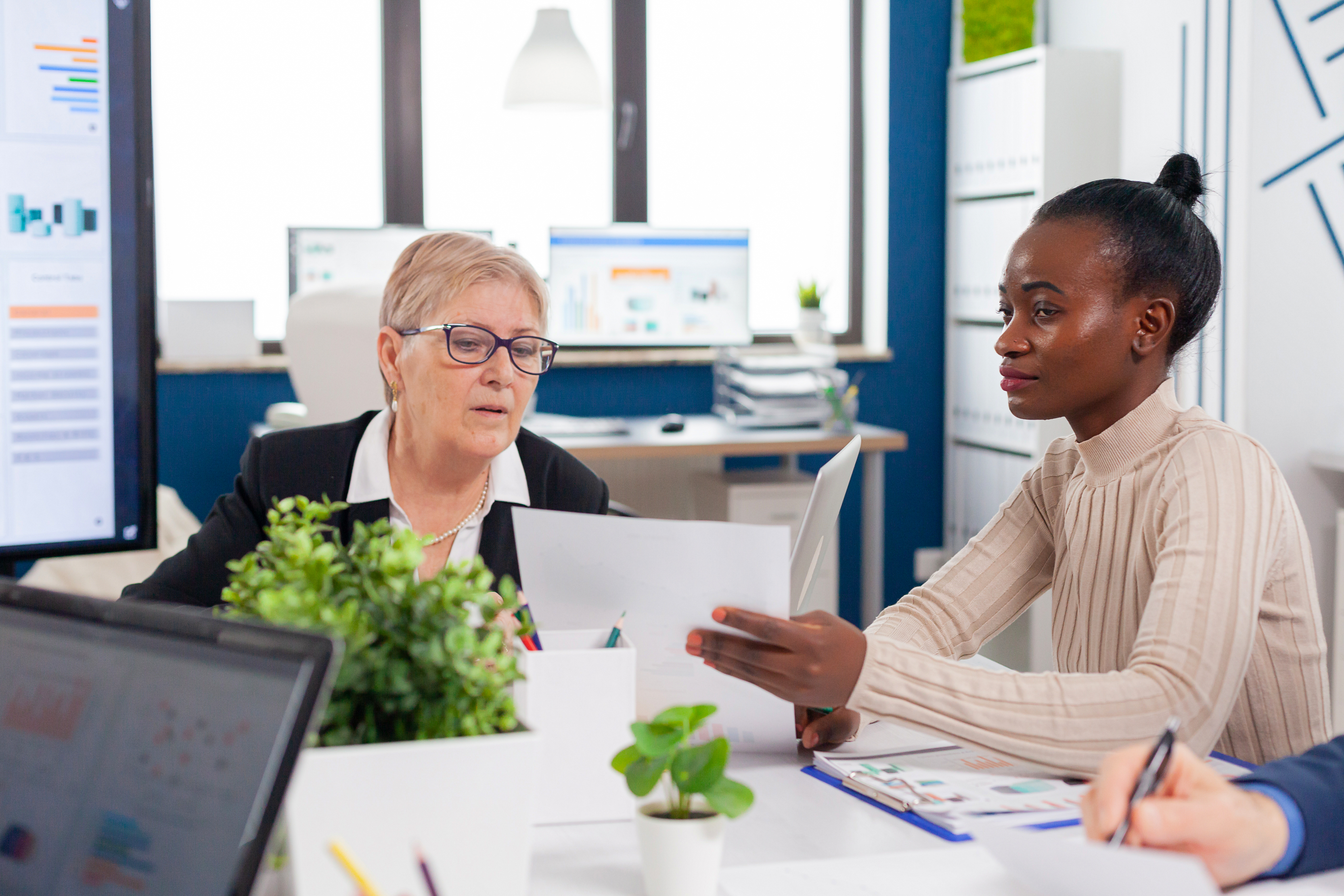 African employee in financial business board meeting room